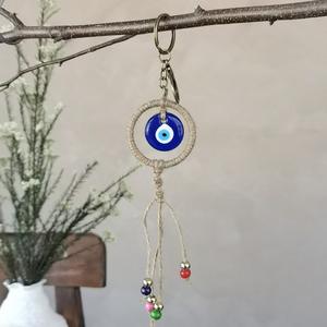 Cadeau tendance : Porte-monnaie porte-bonheur turc en alliage de zinc avec œil bleu et main de Hamsa - Pendentif pour sac/voiture/décoration intérieure - Product Image 1