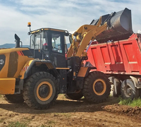 Pelle de chargement 848H : Interface d'attachement polyvalente, configuration flexible pour la manutention de pierre, de terre et de matériaux de construction