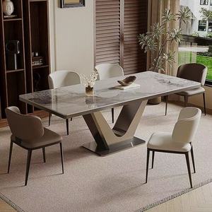 โต๊ะอาหารทรงสี่เหลี่ยมผืนผ้าสไตล์โมเดิร์นมินิมอล พร้อมท็อปหิน ดีไซน์เรียบหรู เหมาะสำหรับครอบครัวขนาดเล็ก รวมเก้าอี้ - Product Image 1