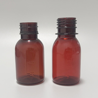 Bouteille vide de solution orale anti-vol rotative à pression transparente brune en PET de 60 ml avec étiquette privée personnalisée