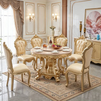 Ensemble de table à manger ronde en marbre de luxe européen, table en bois massif sculptée à la main, finition dorée, chaises en cuir blanc, vente en gros