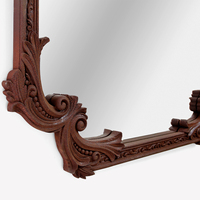 Miroir mural décoratif de style rococo inspiré de Louis XVI, sculpté à la main, avec finition rouille oxydée sur bois d'acajou, pour hôtel de luxe ou villa.