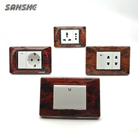 Interrupteurs muraux modulaires DIY SANSHE CE type 118 à grain de bois et prises de courant Schuko françaises et allemandes pour projets hôteliers et résidentiels de design