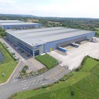 Almacén Prefabricado de Dos Pisos con Estructura de Acero de Diseño Moderno y Alta Calidad, Gran Luz, Alta Resistencia, Resistente al Fuego y al Agua