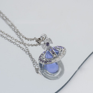 <span class=keywords><strong>Collana</strong></span> con Catene e Ciondolo a Forma di <span class=keywords><strong>Saturno</strong></span> e Stella alla Moda all'Ingrosso per Donna e Uomo, Girocollo in Metallo per Donna, Orecchini e Gioielli - Product Image 5