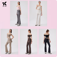 Ensemble de pantalon de yoga évasé à taille haute, avec effet seconde peau, devant uni, maille respirante en dentelle, bonnets intégrés et ourlet amovible style tablier