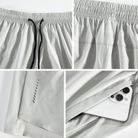Short de gym à séchage rapide pour homme Vêtements d'entraînement unis avec poche zippée Vêtements d'entraînement actifs