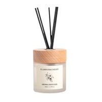 Arôme de décoration de maison de luxe en gros 100ml d'huile essentielle de longue durée diffuseur de roseau de bouteille en verre de marque privée avec couvercle en bois