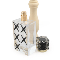 Flacon de parfum rectangulaire transparent de 100 ml avec bouchon découpé à motif noir et col doré, conteneur de parfum vide rechargeable