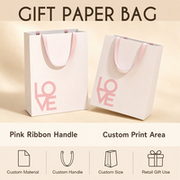 Sac en papier blanc personnalisé avec poignées en ruban rose et face imprimée pour emballage cadeau de détail, acheteurs en gros