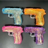 Nouvelle pistolet jouet en TPR anti-stress, pistolet souple transparent avec poudre aurora dorée, jouet anti-anxiété en maltose pour enfants garçons et filles