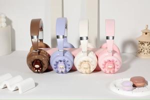 Must - See pour les fans de gentillesse! Oreillette Bluetooth de style beignet en peluche Labubu, commencez un voyage d'écoute adorable - Product Image 4