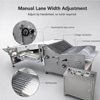 Machine à empiler les biscuits de type roue étoilée, avec arrangement en canal et roulettes sans compression latérale pour ligne de production de biscuits