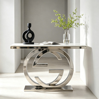 Table console de luxe à double anneau entrelacé avec base sur piédestal, plateau en marbre, table d'entrée en acier inoxydable, table de décoration artistique moderne