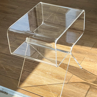 Table d'appoint en acrylique transparent, design à pieds croisés, pour lieux de prise de parole, avec étagère de rangement pour tasses à café et livres, style minimaliste pour la maison