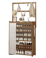 Meuble de rangement mural multi-niveaux avec porte-chaussures intégré, élégant support pour chapeaux et vêtements, et armoire à chaussures pour entrée