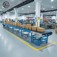 Convoyeur à bande en caoutchouc sur mesure pour entrepôt, avec structure en acier bleu robuste, pour la logistique et la livraison express