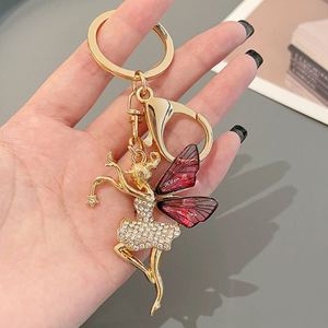 New Metal Diamond Dance Wings Girl Keychain High End Accessories Bag Pendant Car Keyring Small Jewelry <b>Key</b> <b>Chain</b> - Product Image 6