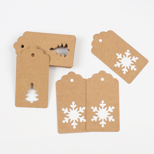 Etiquetas colgantes de papel kraft Jingxin con recortes de copo de nieve y árbol, 50 hojas, etiquetas de regalo navideñas - Product Image 1
