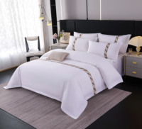 Ensemble de literie d'hôtel de luxe OEM avec logo personnalisé, bordure en jacquard doré, ensemble de literie classique blanc et noir avec rayures brodées