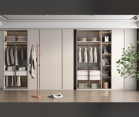 Solution de Rangement Moderne : Armoire Bicolore Blanc & Marron à Trois Portes, Tiroirs, Éclairage Intelligent Chaleureux, Penderie et Rangement Pliant
