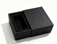 Boîte cadeau rigide à tiroir coulissant de luxe, surface à motif de feuilles en relief, insert en mousse EVA noire personnalisé pour l'emballage de parfums et de cosmétiques