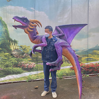Marionnette de dragon réaliste en gros, marionnette animatronique de bébé dinosaure à vendre