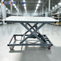 Table de soudage robuste à hauteur réglable hydrauliquement pour l'industrie
