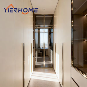 <span class=keywords><strong>Armoire</strong></span> de chambre principale moderne et luxueuse YIERHOME |   Portes en contreplaqué avec cadre en aluminium doré sur mesure, pliables et assemblées du sol au plafond - Product Image 1