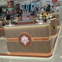 Vitrines modernes de luxe en bois et verre avec éclairage LED et comptoirs de caisse personnalisés pour centres commerciaux haut de gamme et kiosques de cosmétiques