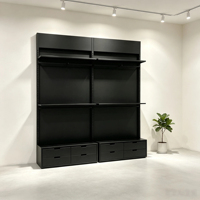 Système d'affichage modulaire en métal noir avec base à 12 tiroirs et design sans poignée pour magasin de détail haut de gamme