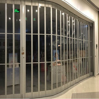 Cloison pliante de porte en verre cristal au design moderne Surface commercialement finie pour salon de beauté Lave-voiture Villa Garage Cuisine