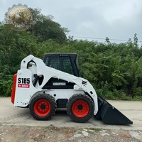 Chargeuse sur pneus Bobcat S185 d'occasion en bon état de marche pour travaux d'aménagement paysager et municipaux