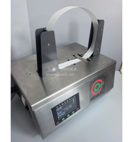 Machine automatique de cerclage de cartons avec bande adhésive, thermoscellante, pour l'emballage manuel des boîtes