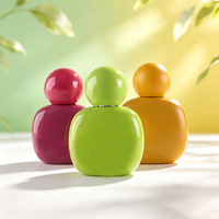 Flacon de parfum de luxe en verre forme galet 30ml 50ml 100ml avec capuchon sphérique couleur personnalisée vide rechargeable vaporisateur de voyage