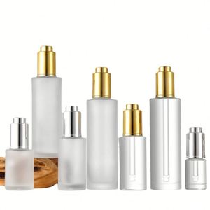 Skin Care 10ml 20ml 30ml 50ml <b>Press</b> Pump Gold Cap Essential Oil Bottles Flat Shoulder Push <b>Button</b> Serum Dropper Bottle - Product Image 3