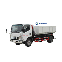 Camion benne à ordures diesel ISUZU 4x2 avec crochet, chargement latéral 5m³/10m³, transmission manuelle avec moteur et boîte de vitesses, en promotion