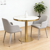 Table à manger ronde en marbre blanc avec base dorée en acier inoxydable plaqué, design nordique moderne, pour restaurant