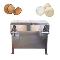 Machine à raser et à défibrer la noix de coco décortiquée
