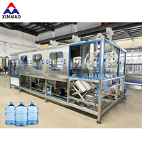 Ligne de machines de fabrication de bouteilles d'eau de 19 litres 120-1200BPH, machine de remplissage d'eau en bouteille de 5 gallons au Nigeria