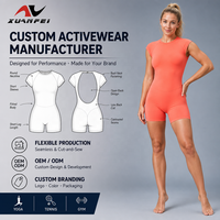 Combinaison de yoga pour femme, couleur orange corail, 1 pièce, col rond, manches courtes, dos ouvert, short moulant, logo personnalisé OEM ODM, gym, fitness, entraînement