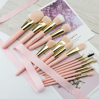 Ensemble professionnel de 15 pinceaux de maquillage en poils naturels roses avec manche en bois écologique et design rose doré respectueux de la peau