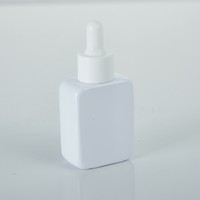 Flacon de sérum blanc rond personnalisé de 10ml 20ml 30ml 50ml 100ml emballage de soins de la peau flacons compte-gouttes personnalisés d'huile essentielle pour Cosmet
