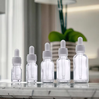 Flacon compte-gouttes en verre cylindrique personnalisable pour les soins de la peau de 15ml 30ml 50ml 100ml Capacités Plat Vide Sérum Emballage Vis gratuite