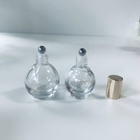 Vente en gros 10ml bouteille en verre de rouleau en forme de boule ronde transparente avec bouchon en or brillant
