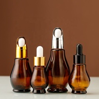 Vente en gros de flacons cosmétiques en verre ambré en forme de gourde de 50 ml, imprimés à l'écran, avec couvercle doré et pulvérisateur à pompe pour le stockage de lotion
