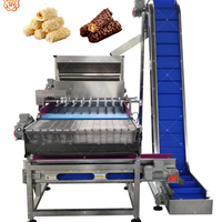 Machine automatique TUORONG pour la saupoudrage de noix et l'application uniforme de chocolat sur les snacks enrobés de chocolat et de caramel