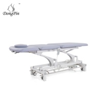 Table de physiothérapie électrique Dongpin Lit de massage médical réglable de conception moderne pour le traitement et l'examen pour le salon