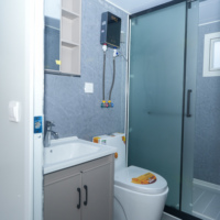Maison modulaire extensible personnalisable en structure acier, type conteneur, avec chambre, salle de bain et cuisine