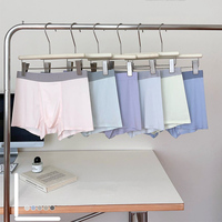 Sous-vêtements en soie glacée sans couture en polyester pour hommes caleçon taille moyenne respirant pantalon en tissu tricoté pour troncs de gros
